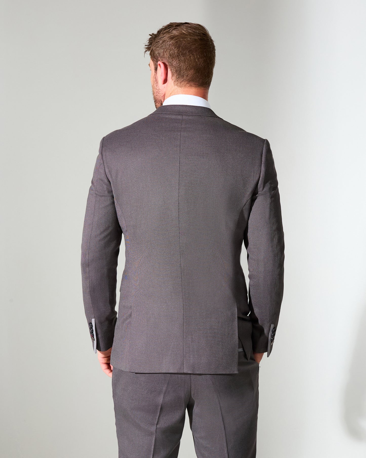 close tailored fit dark grey textured suit- hilltop rock grey